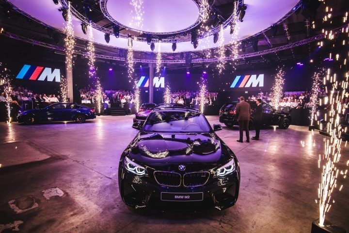 Spark fountains around a new BMW at its reveal
