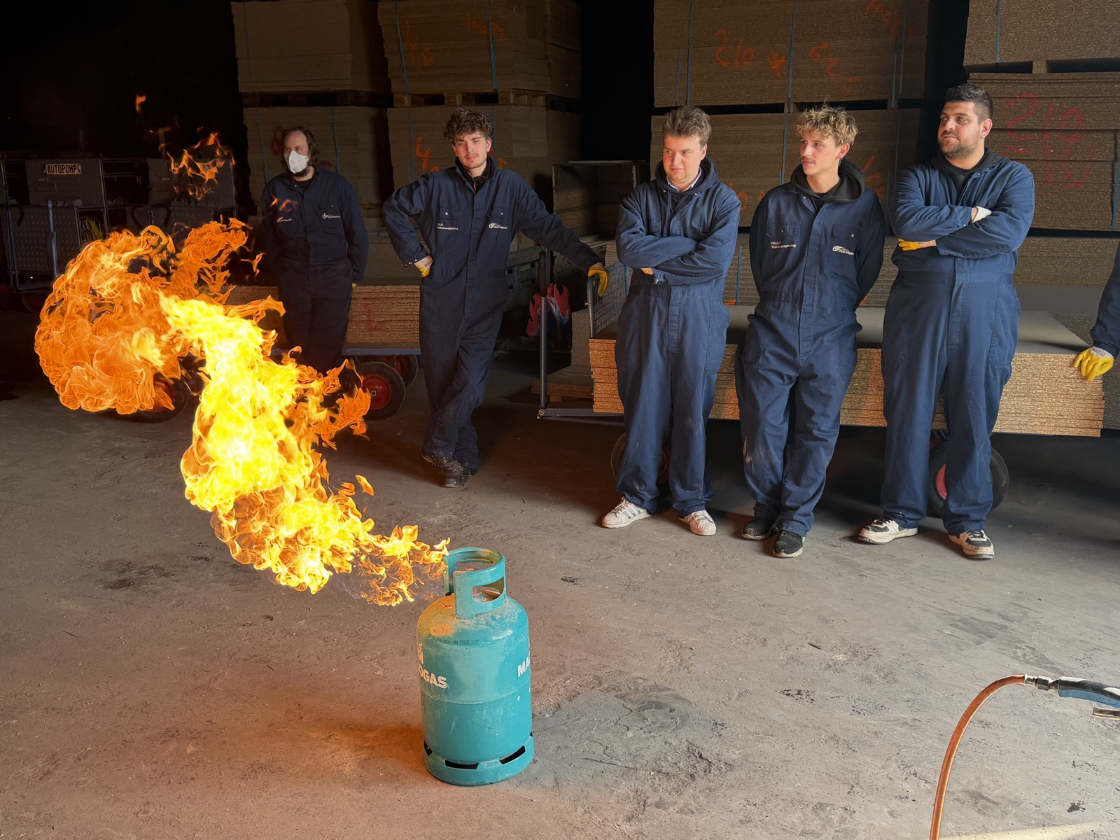 Practising with a gas fire during the firefighting course