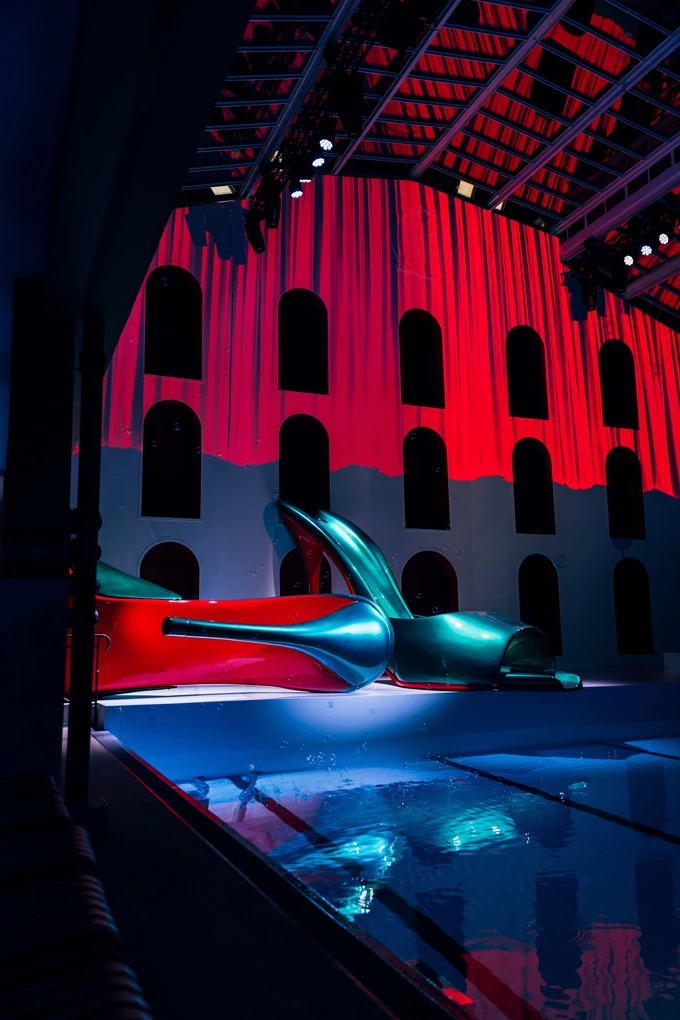 Bubbles floating over the pool in front of the set of the Louboutin Spring/Summer 2025 show at the Molitor, Paris
