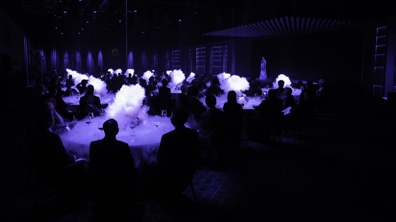 Low fog rolling between the tables at a gala dinner, 2023