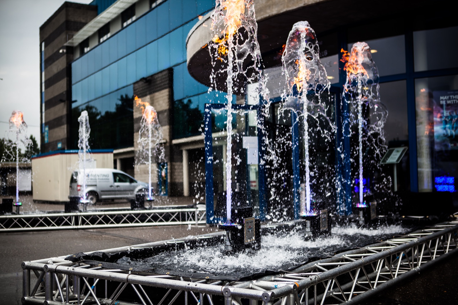 Pools with water jets and flames in a truss frame at the entrance of the KRC Genk stadium, 2016